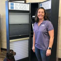 Lander area manager, Pam in front of a blind display at Ron's Flooring in Lander WY