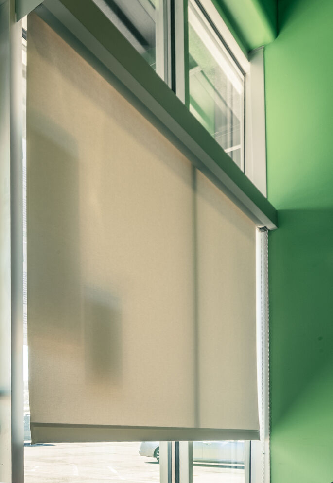 Manual Roller Shades for South-Facing Storefront Glare at The Green Spot in Omaha, NE