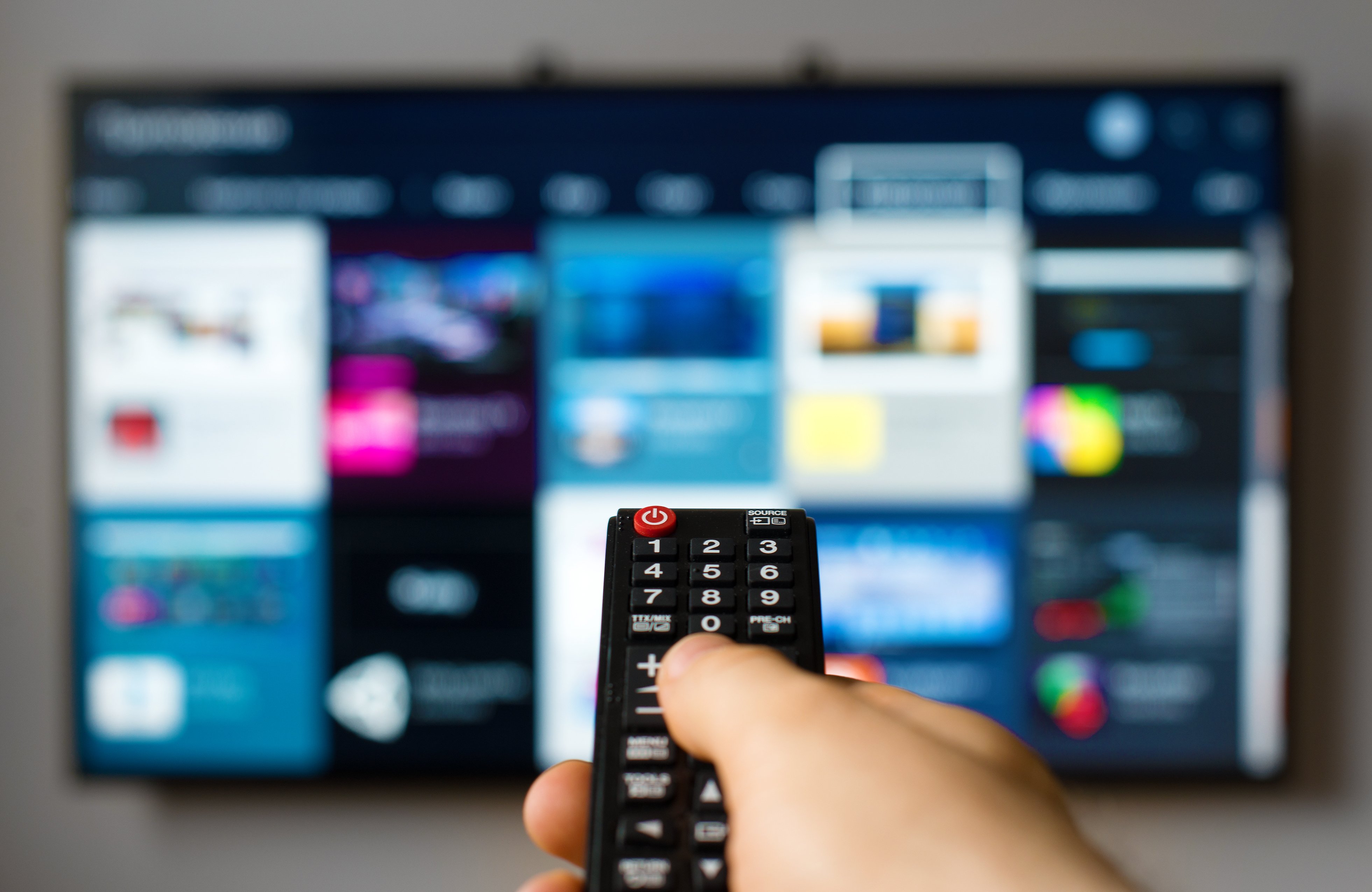 smart home technology, man using a smart tv