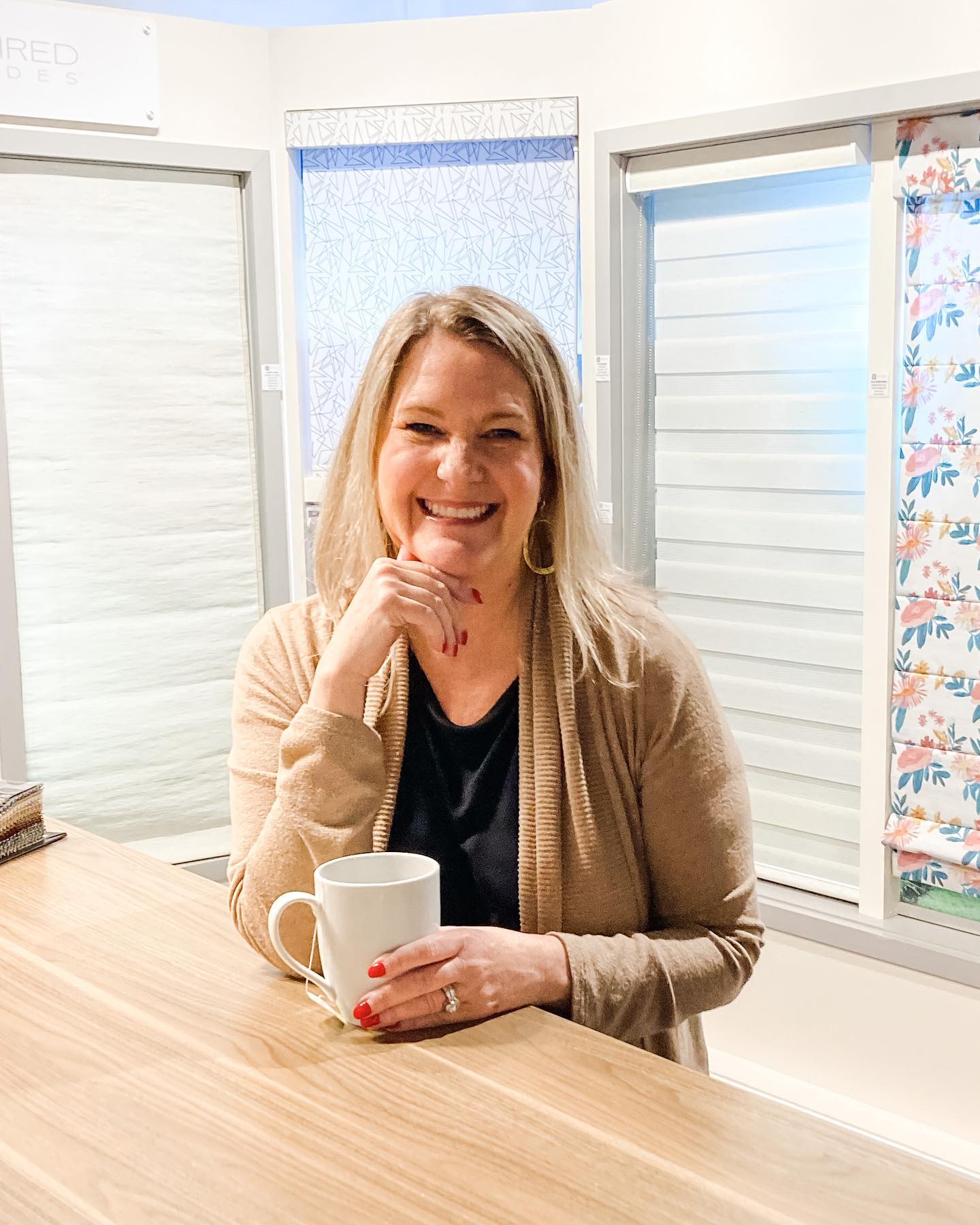 michelle with coffee cup in showroom