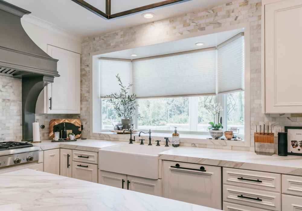 Cellular Shades on Bay Windows in a Kitchen