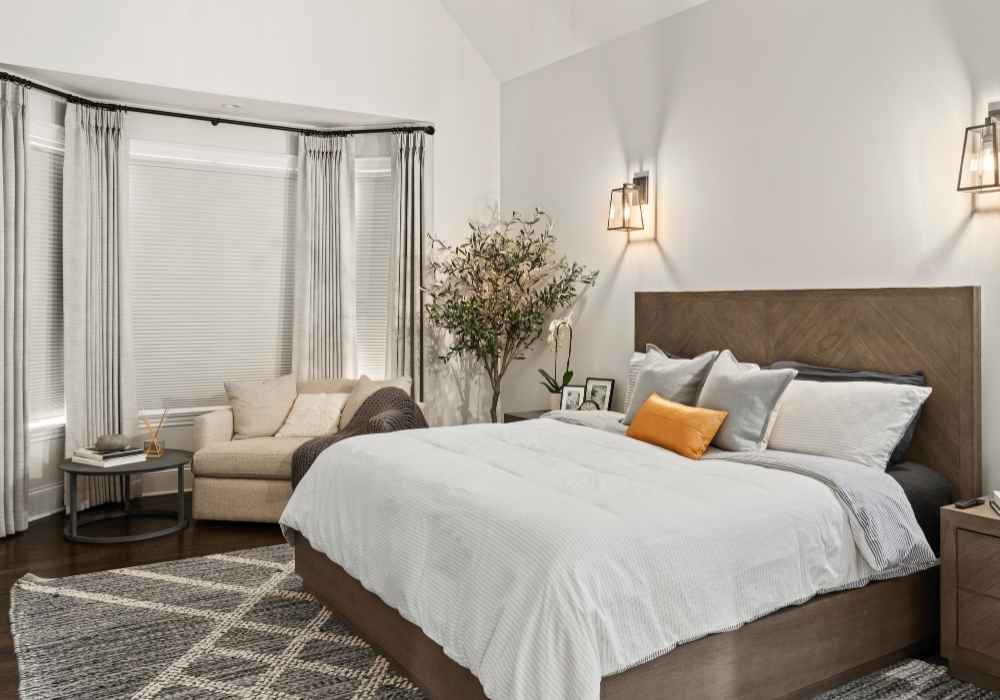 Room-Darkening Cellular Shades with Drapery in a Bedroom