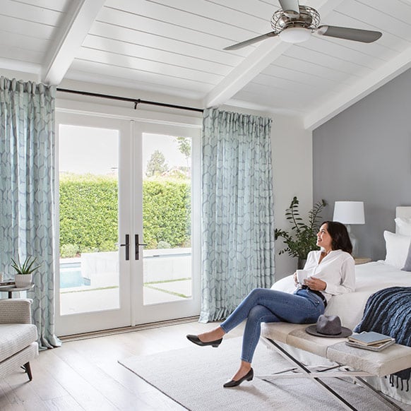 Woman Looking at New Drapes