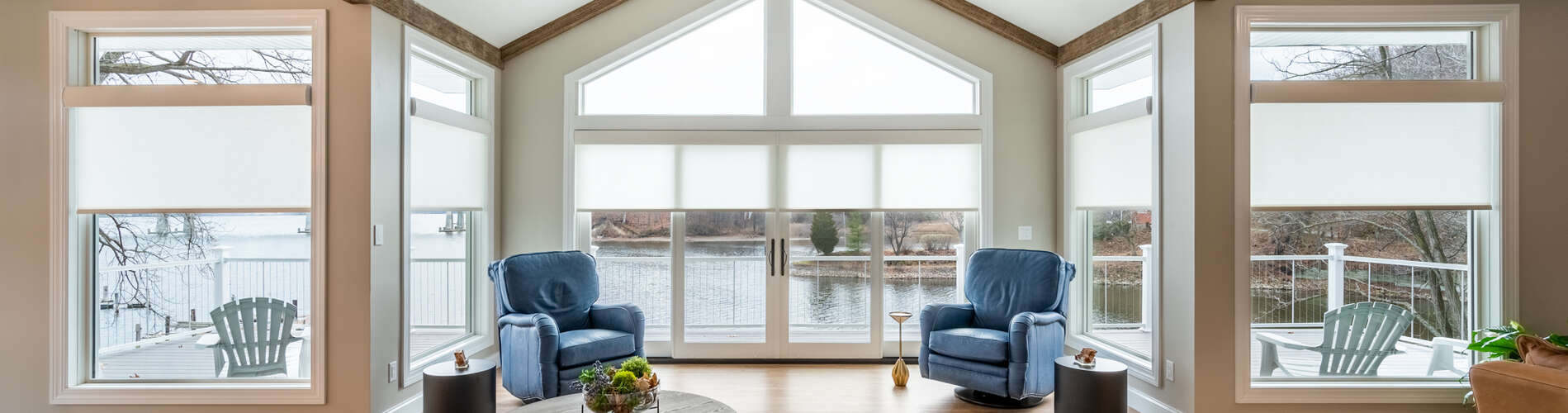white roller shades over windows and doors