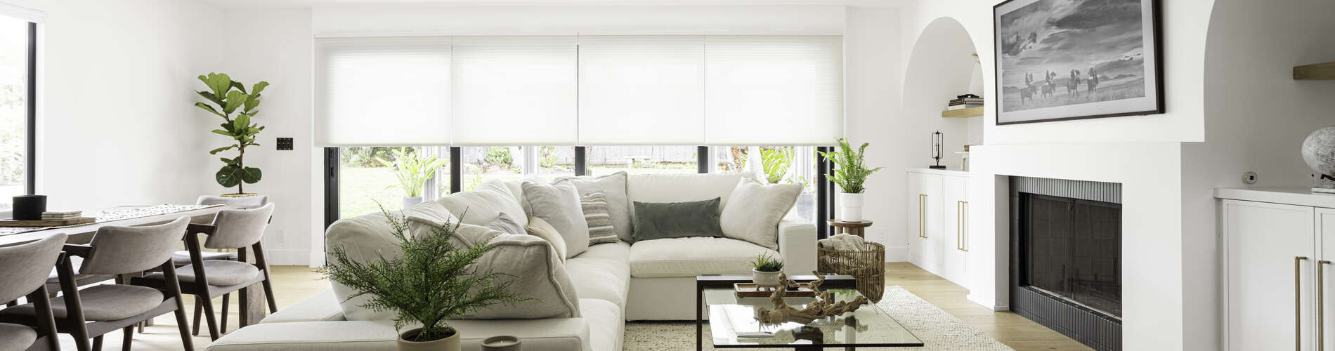 white cellular shades over large patio doors in living room