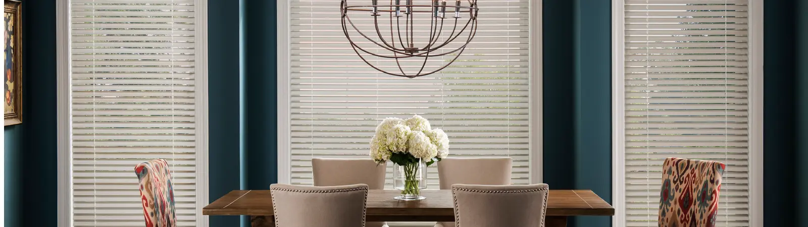 white blinds in a turquoise dining room