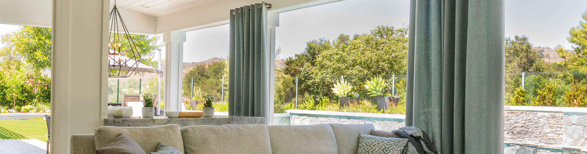 solid blue/green drapery panels in outdoor patio