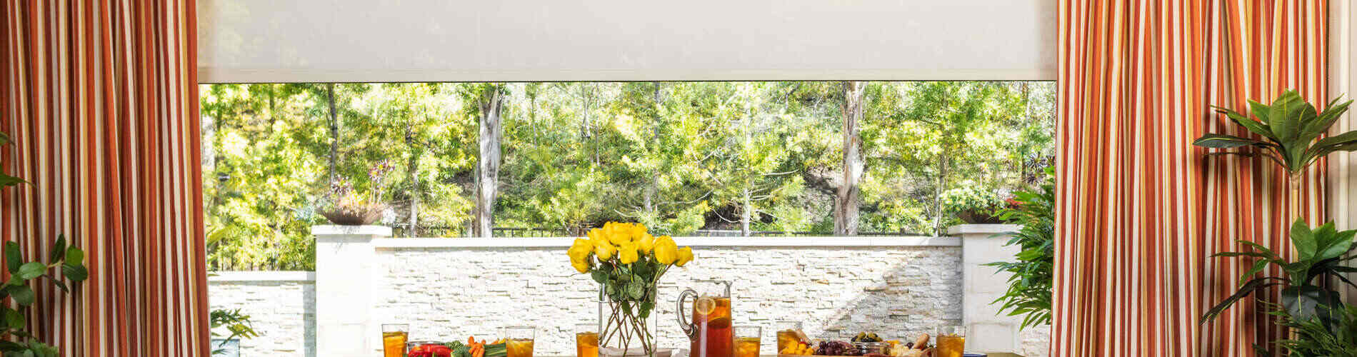 red orange and yellow striped drapery in patio