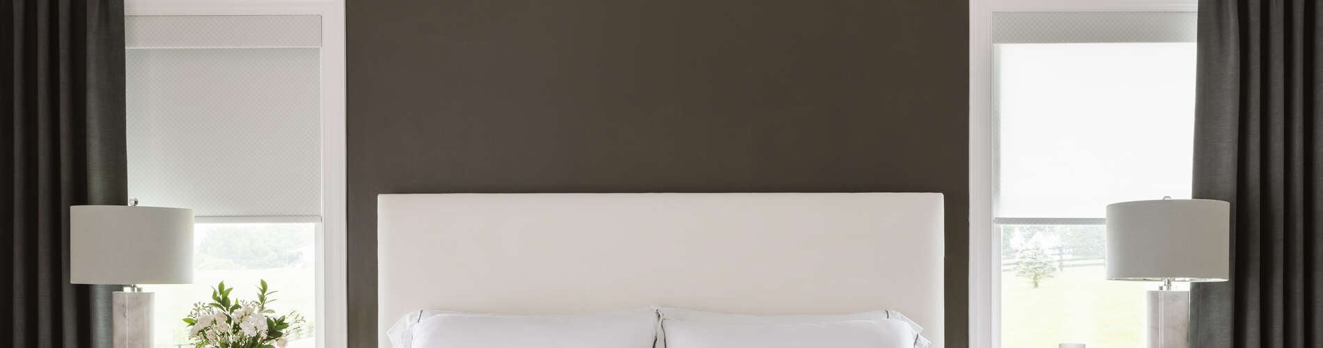 roller shades and drapery in bedroom
