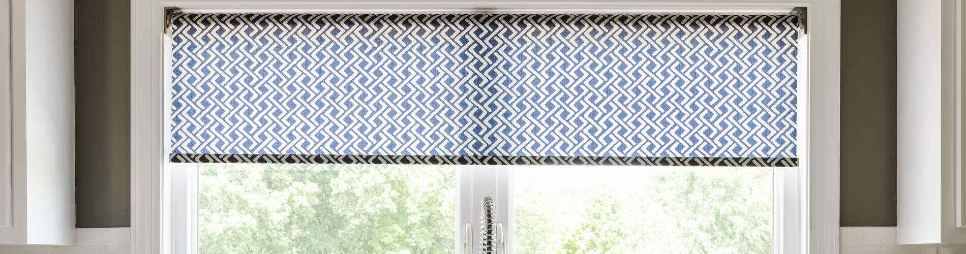 blue patterned roller shade kitchen