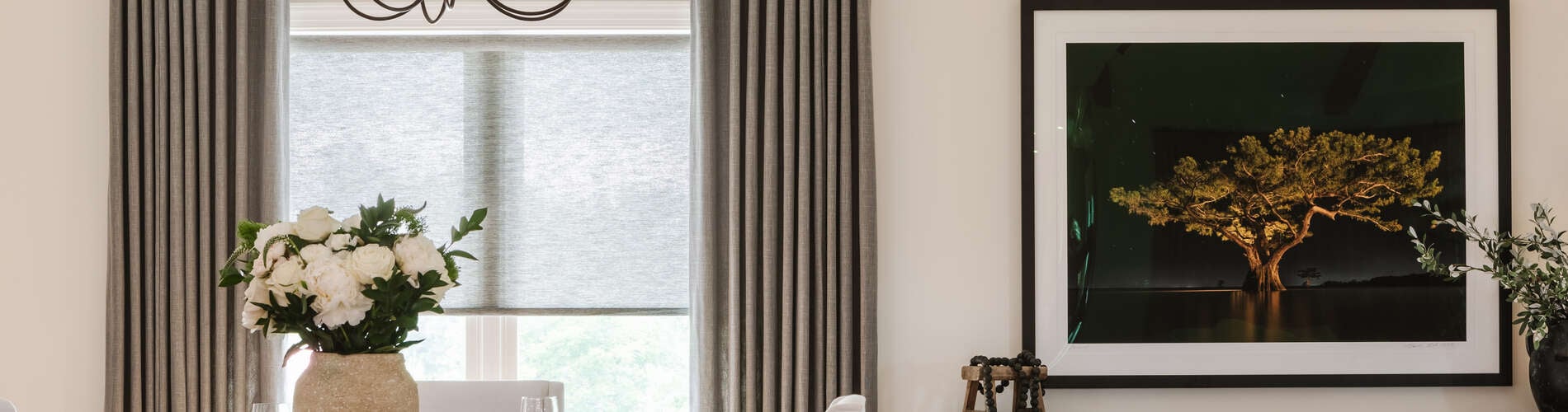 roller shade and drapery in dining room