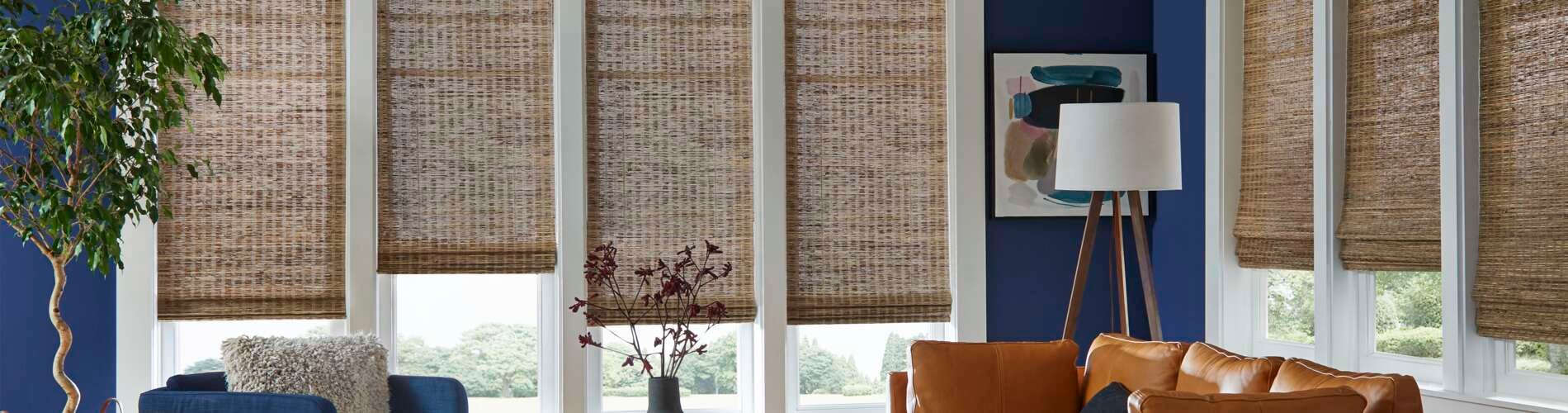 Bamboo shades in blue living room 