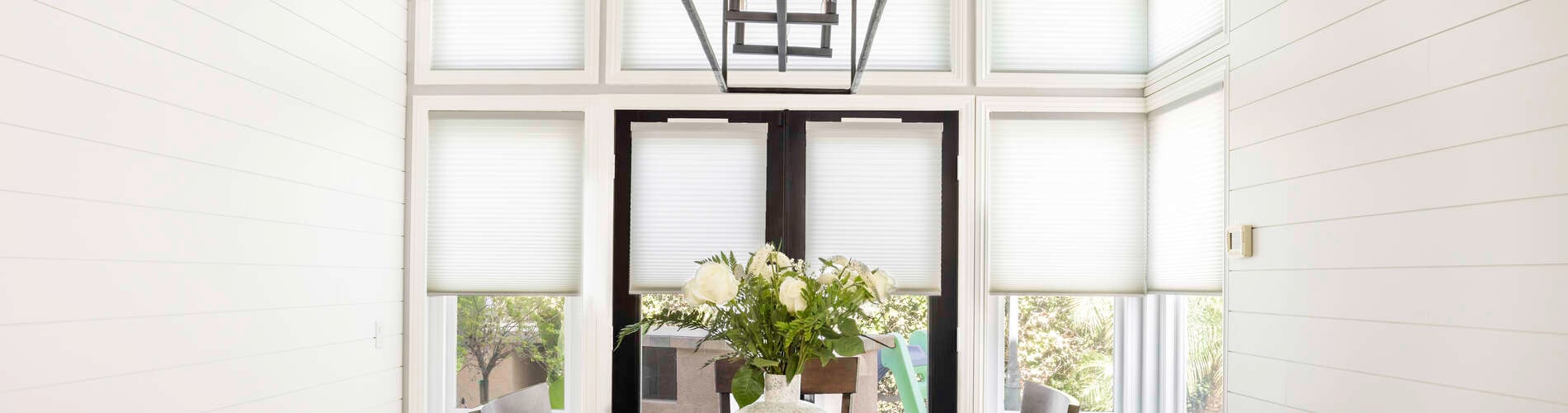 white cellular shades in neutral dining room